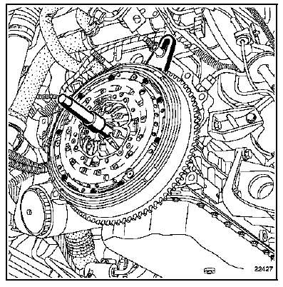 Reposer le mécanisme sur le volant moteur en serrant